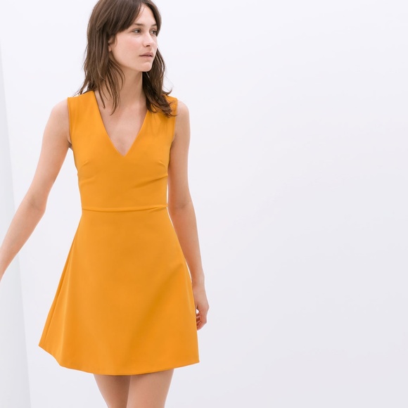 Zara Dresses & Skirts - SOLD! HP Zara Flared Dress with Bow At Back